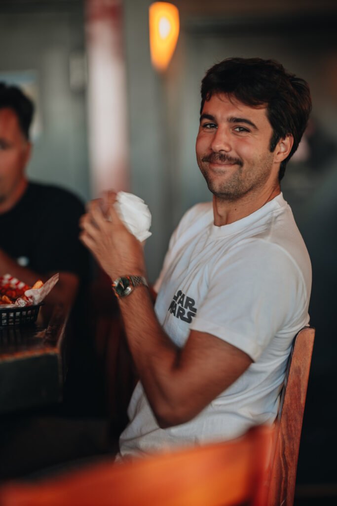 Patron smiling while seated at the bar