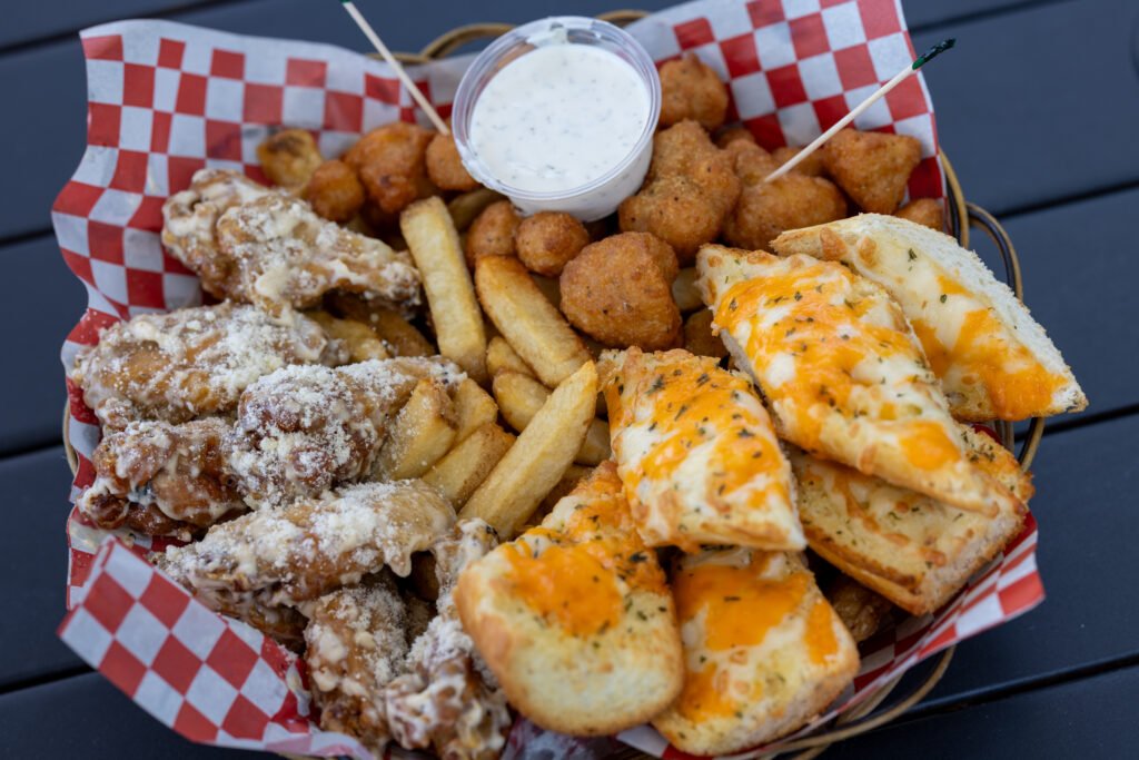 Wings, fries, breaded appetizers and cheese toast with dipping sauce