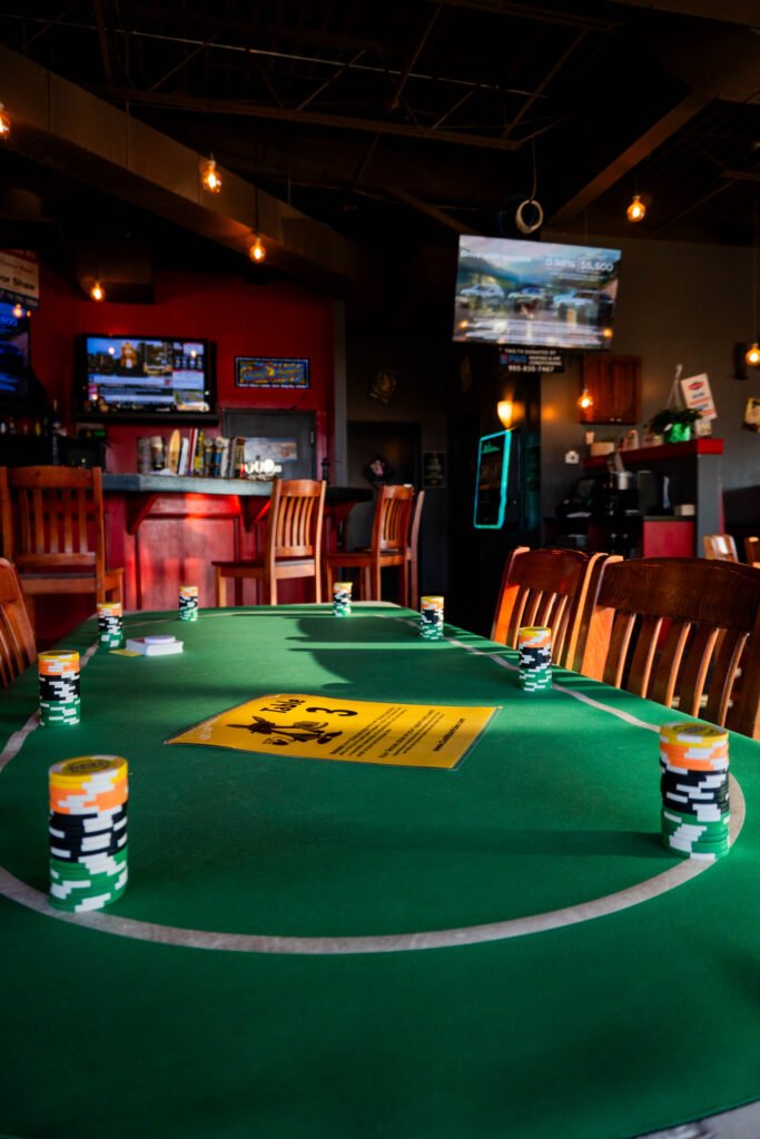 Poker chips arranged around a green card table