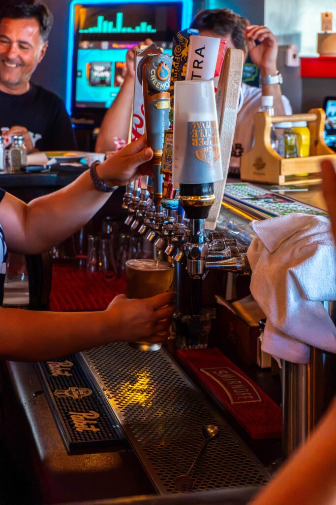 Beer taps and patrons gathered at the bar
