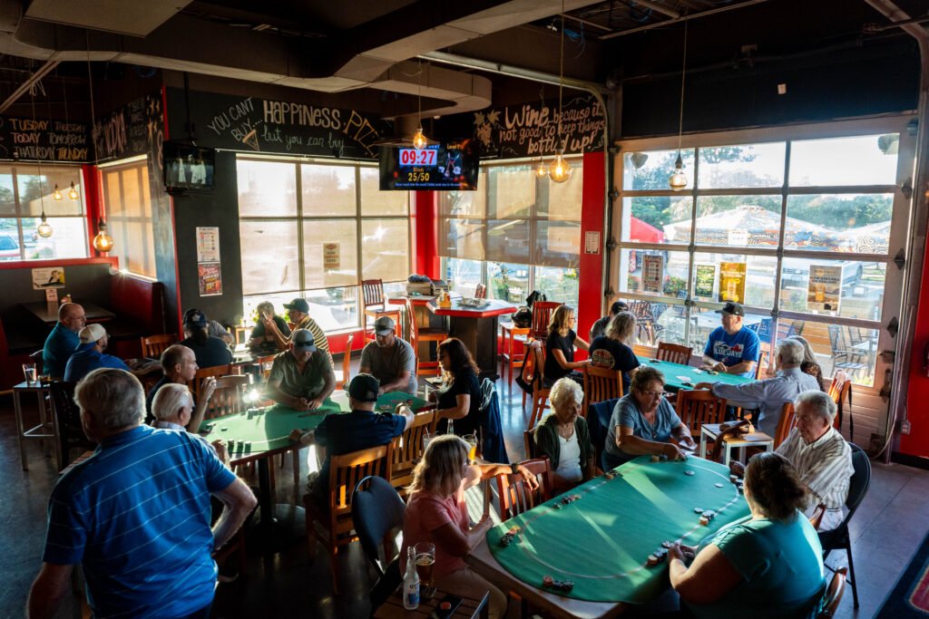 Guests gathered around several poker tables inside the pub